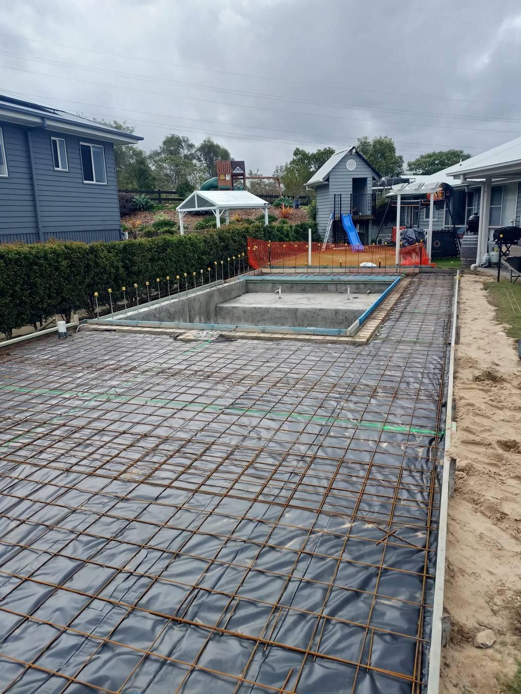 Formwork and reinforcement mesh set out by JRB around a pool